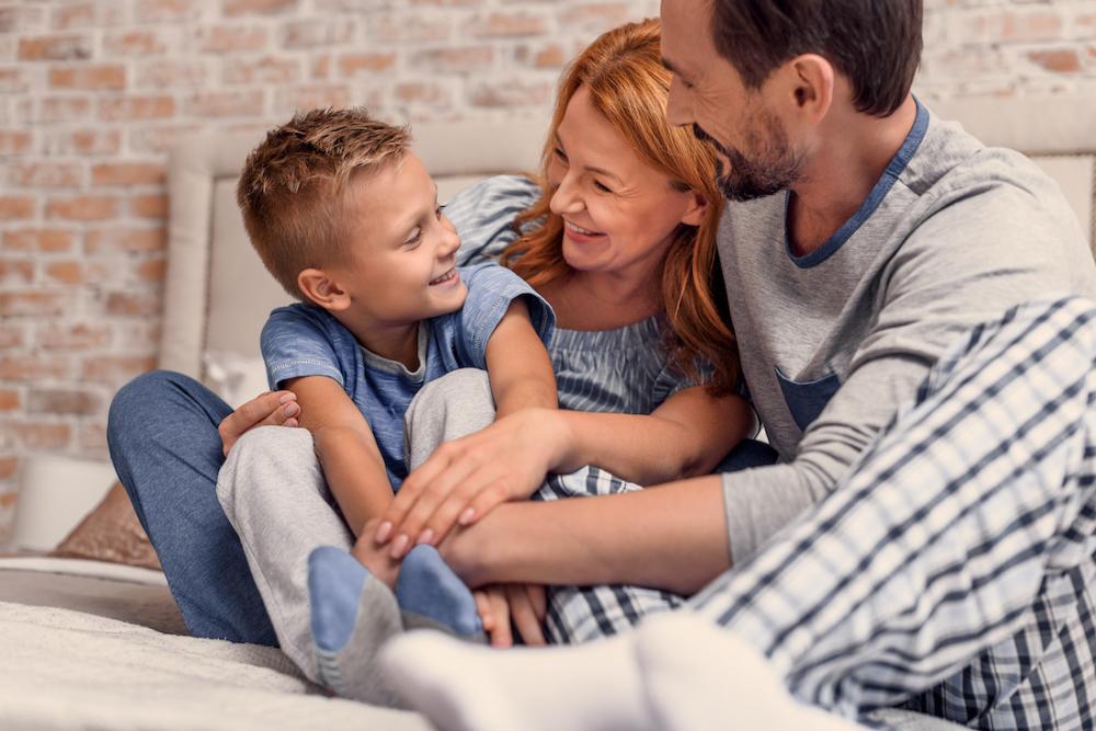 Mom and dad with son smiling, huntsville al
