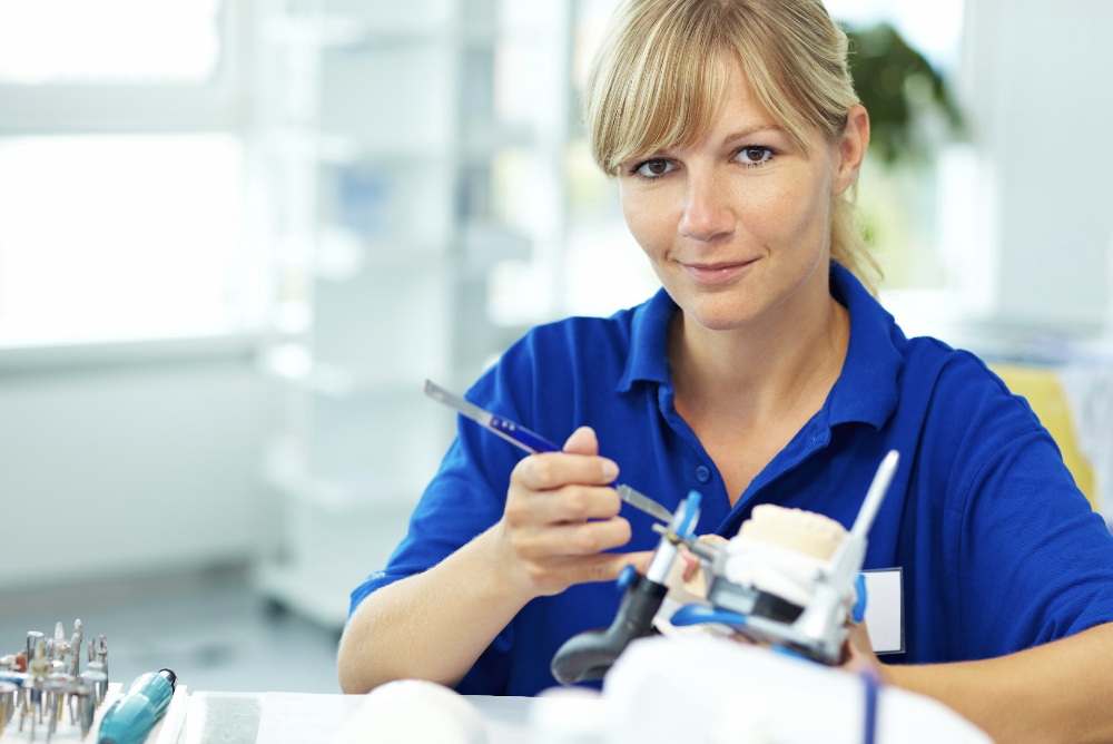 Woman with blonde hair in dental school, huntsville al