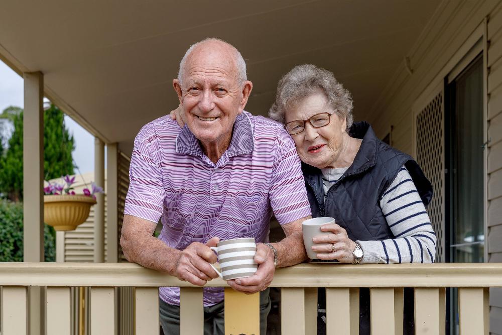 A couple smiling on the porch | all on 4 implants huntsville
