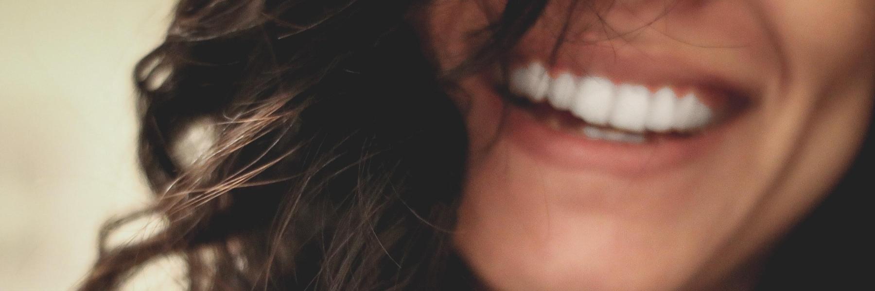 Woman smiling after visit to Huntsville cosmetic dentist