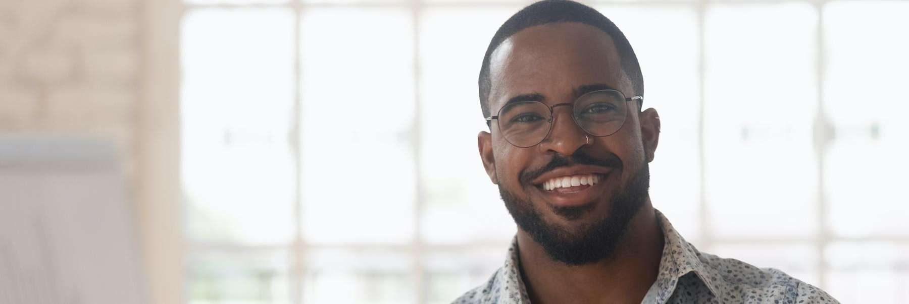 man with glasses smiling | dentist in huntsville al