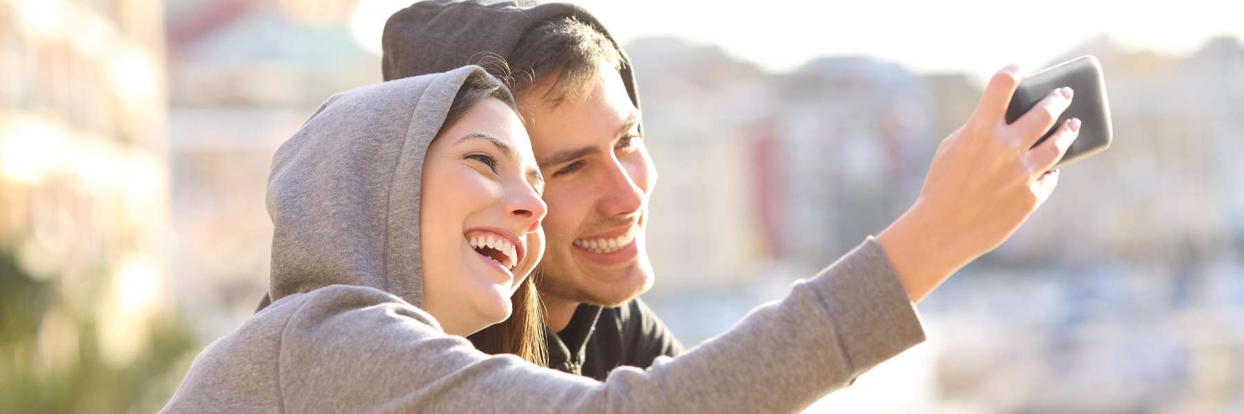 2 people smiling while taking a selfie | Dentist Huntsville, AL
