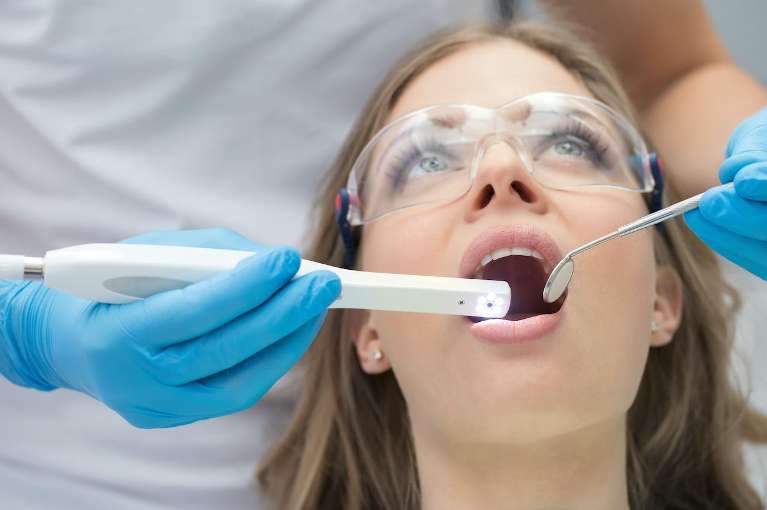Woman getting teeth cleaned, huntsville al