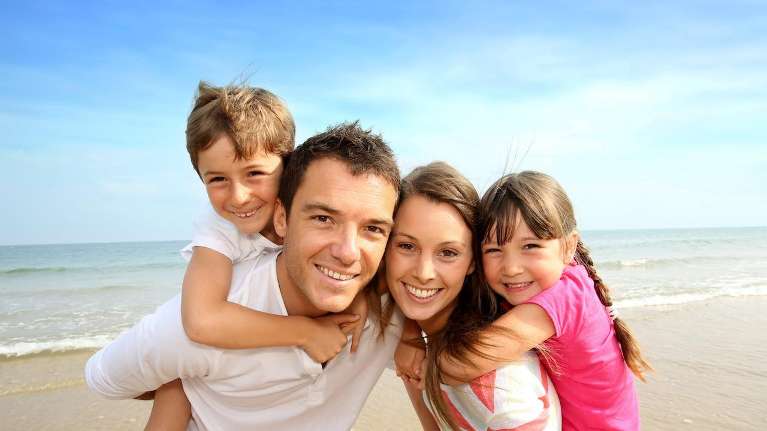 A family at the beach | pediatric dentist Huntsville