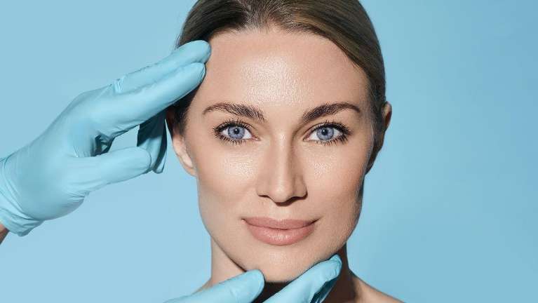 woman smiling with dentist | botox in hunstville 