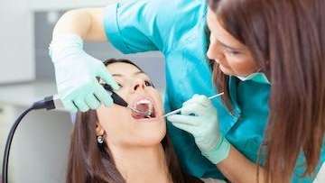 Woman getting a tooth extraction, Huntsville AL