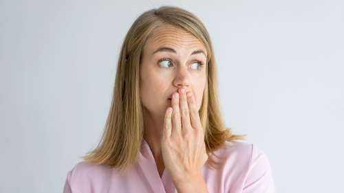 Woman holding her mouth in shock, huntsville al