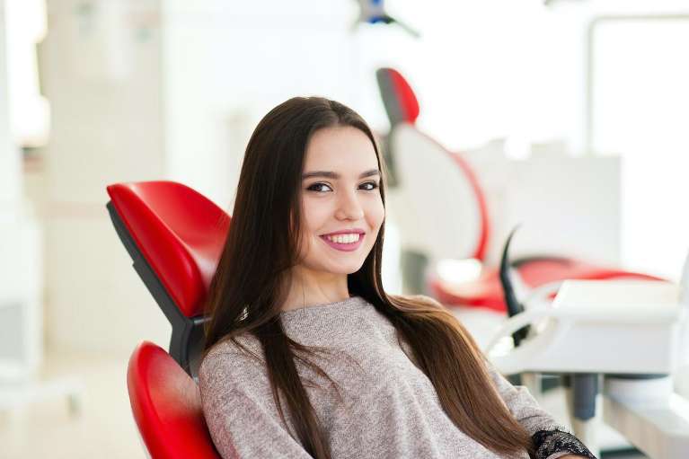 Girl in dental chair after teeth whitening, huntsville al