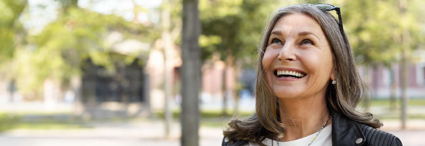 Older woman smiling outdoors in huntsville, al