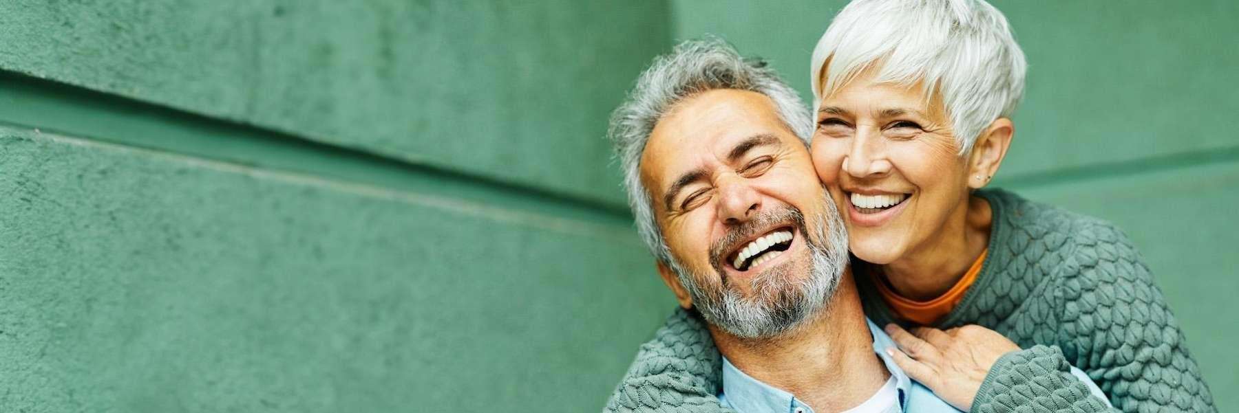 White haired man and woman hugging and smiling, huntsville al