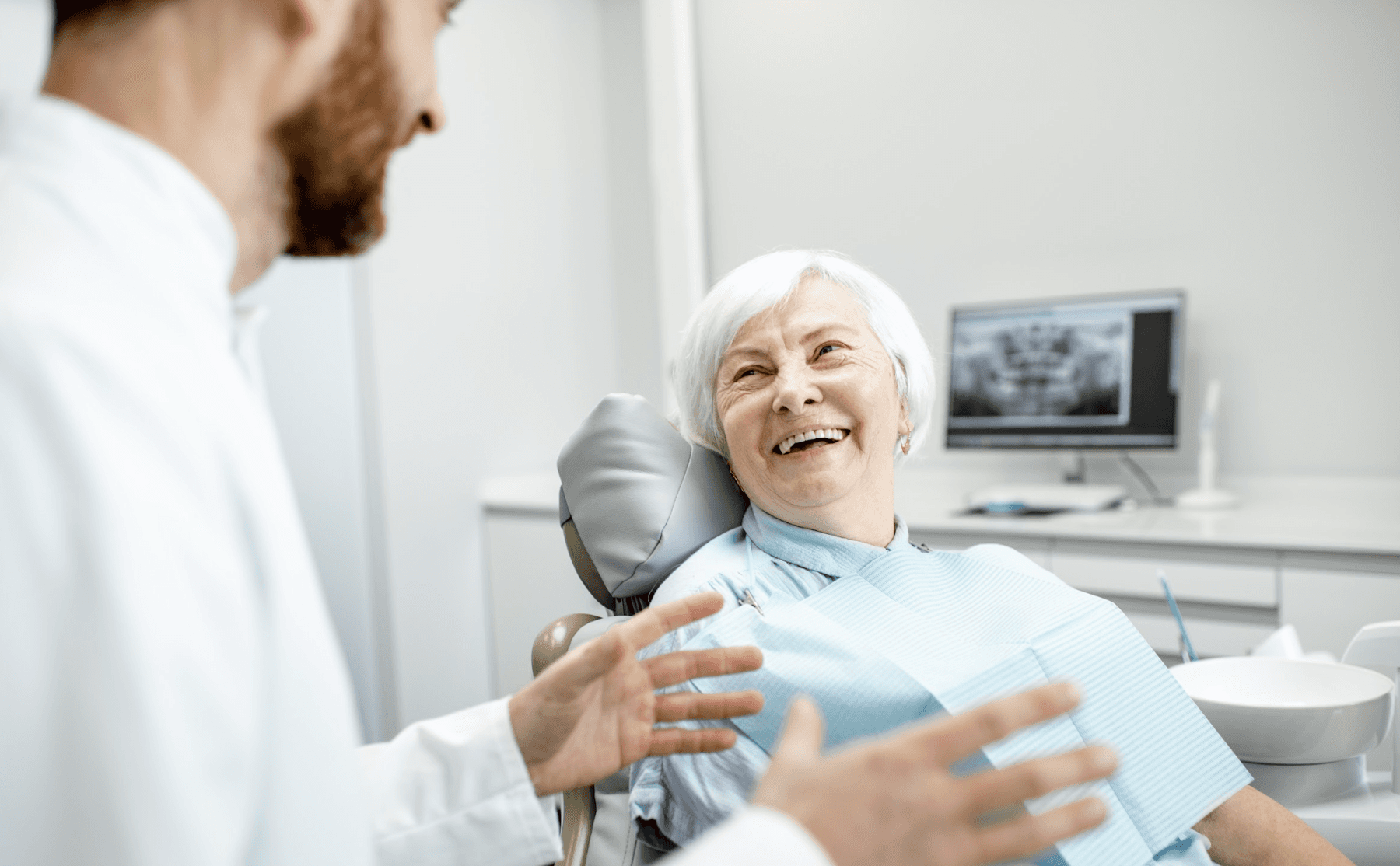 Older white woman smiling in a dentist chair, huntsville al