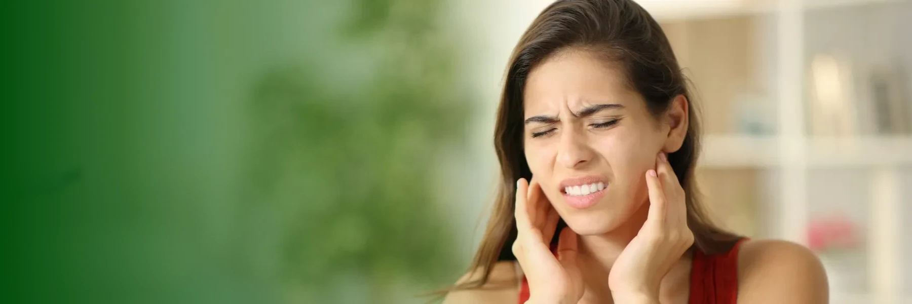 Woman holding her jaw in pain, huntsville al